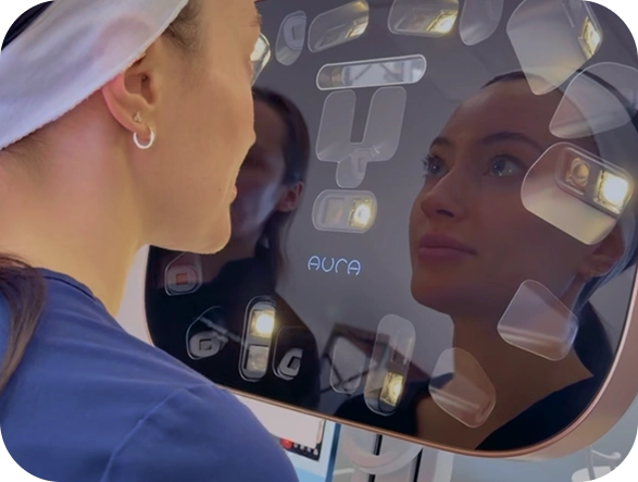 Client viewing her 3D facial analysis scan at Juvly